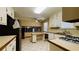 Open kitchen featuring white cabinets and tile flooring at 494 Rue Montaigne, Stone Mountain, GA 30083