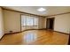 Spacious living room with hardwood floors and bay window at 494 Rue Montaigne, Stone Mountain, GA 30083