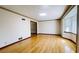 Bright living room featuring hardwood floors, window, and white walls at 494 Rue Montaigne, Stone Mountain, GA 30083