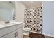 Bathroom featuring a patterned shower curtain, toilet and single vanity at 115 Laurelwood Ln, Dallas, GA 30157