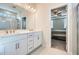 Stylish bathroom with double sinks and a glass-enclosed shower and view to bedroom at 115 Laurelwood Ln, Dallas, GA 30157