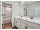 Bright bathroom featuring double vanity with white cabinets, quartz countertop, and shower-tub combination at 115 Laurelwood Ln, Dallas, GA 30157