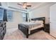 A Primary bedroom with a bed and ceiling fan at 115 Laurelwood Ln, Dallas, GA 30157