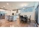 Bright, open kitchen featuring stainless steel appliances, granite countertops, and a cozy dining area at 115 Laurelwood Ln, Dallas, GA 30157