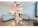 Open concept living area with hardwood floors, comfortable seating, and a view of the modern kitchen at 115 Laurelwood Ln, Dallas, GA 30157