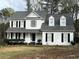 Charming two-story white home with black shutters and a welcoming front porch at 2105 Fair Ridge Ct, Jonesboro, GA 30236