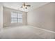 Bedroom featuring neutral carpeting, a ceiling fan, and a window at 2404 Caneridge, Marietta, GA 30064