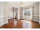 Hardwood floors in the entryway with decorative molding and a window at 2404 Caneridge, Marietta, GA 30064