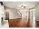 Bright living area with fireplace, hardwood floors, and staircase access at 2404 Caneridge, Marietta, GA 30064