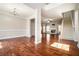Open-concept living area with hardwood floors, fireplace, and staircase at 2404 Caneridge, Marietta, GA 30064
