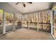 Enjoy the outdoors on the screened porch with views of the wooded backyard at 2404 Caneridge, Marietta, GA 30064