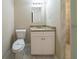 Bathroom features a pedestal sink, commode and tile flooring at 3645 Larkspur Ter, Decatur, GA 30032
