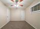 This bedroom has a ceiling fan, neutral carpet, and a double closet at 3645 Larkspur Ter, Decatur, GA 30032