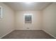 Cozy bedroom with neutral carpet and a window at 3645 Larkspur Ter, Decatur, GA 30032