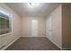 Clean, carpeted bedroom with a window and white doors at 3645 Larkspur Ter, Decatur, GA 30032