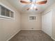 Cozy bedroom features neutral carpet, a ceiling fan, and ample closet space at 3645 Larkspur Ter, Decatur, GA 30032