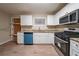The kitchen shows granite countertops, white cabinets, and new stainless steel appliances at 3645 Larkspur Ter, Decatur, GA 30032