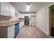 Modern kitchen with white cabinets, stainless steel appliances, and granite countertops at 3645 Larkspur Ter, Decatur, GA 30032