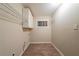 Functional laundry room with overhead cabinets and hanging rack at 3645 Larkspur Ter, Decatur, GA 30032