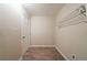 Laundry room with built-in hanging rack and wood-look floors at 3645 Larkspur Ter, Decatur, GA 30032