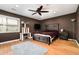A stylish bedroom with a ceiling fan, wood floors, and a cat tree at 3501 Roswell Ne Rd # 211, Atlanta, GA 30305