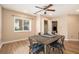 Bright dining room with a square table, seating for four, a window, and hardwood floors at 3501 Roswell Ne Rd # 211, Atlanta, GA 30305