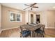 Dining area with wood-look floors, square table, and natural light from a large window at 3501 Roswell Ne Rd # 211, Atlanta, GA 30305
