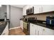 Kitchen featuring sleek countertops, stainless steel appliances, and white cabinetry at 3501 Roswell Ne Rd # 211, Atlanta, GA 30305