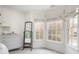 Bedroom corner featuring windows with custom shades, a mirror, and a dresser at 833 Forest Path Ln, Alpharetta, GA 30022