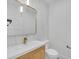 Stylish powder room with designer mirror, sleek vanity, and modern fixtures, offering a touch of elegance at 195 Hope Hollow Rd, Loganville, GA 30052