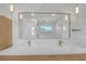 Bathroom featuring double sinks, a marble countertop, and modern lighting fixtures at 195 Hope Hollow Rd, Loganville, GA 30052
