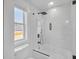 Modern bathroom with sleek bathtub shower featuring a clear glass door and black hardware at 195 Hope Hollow Rd, Loganville, GA 30052