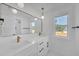 Modern bathroom featuring a double vanity with sleek fixtures and marble countertops at 195 Hope Hollow Rd, Loganville, GA 30052