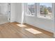 Bright bedroom features wood floors, natural light, and neutral tones, creating a cozy and inviting retreat at 195 Hope Hollow Rd, Loganville, GA 30052