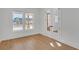Bright bedroom featuring a view, wood floors, and double French doors at 195 Hope Hollow Rd, Loganville, GA 30052