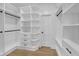 Walk-in closet featuring custom shelving, drawers, and ample storage space at 195 Hope Hollow Rd, Loganville, GA 30052