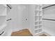 Well-organized walk-in closet featuring custom shelving and plenty of room for storage at 195 Hope Hollow Rd, Loganville, GA 30052