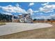 A large concrete driveway leads to a modern, two-car garage with extra single car garage, offering plenty of parking at 195 Hope Hollow Rd, Loganville, GA 30052