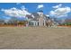 Stunning two-story home boasting a large front yard and architectural details at 195 Hope Hollow Rd, Loganville, GA 30052