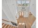Grand foyer with soaring ceilings, wood floors, chandelier, and plenty of natural light, creating a stunning entry at 195 Hope Hollow Rd, Loganville, GA 30052