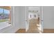 Open concept living space viewed from the foyer with hardwood floors and abundant natural light at 195 Hope Hollow Rd, Loganville, GA 30052