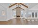 Bright living room with vaulted ceiling, fireplace, and a wall of windows at 195 Hope Hollow Rd, Loganville, GA 30052
