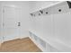 Mud room has custom-built shelving, storage, and door to outside, perfect for organizing outdoor gear and shoes at 195 Hope Hollow Rd, Loganville, GA 30052