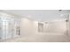 Large finished basement space with white trim, carpet, and walk up stairs at 535 Woodbrook Way, Lawrenceville, GA 30043