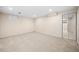 Basement with neutral carpet, closet with mirrored doors, and recessed lighting at 535 Woodbrook Way, Lawrenceville, GA 30043