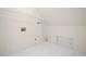 Well-lit laundry room with tiled floors and a built-in shelving unit at 535 Woodbrook Way, Lawrenceville, GA 30043