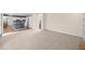 Open-concept living room with neutral carpet and view of the kitchen at 535 Woodbrook Way, Lawrenceville, GA 30043