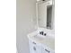 Bathroom vanity with white marble countertops, modern fixtures, and ample storage space at 4080 Brushymill Ct, Loganville, GA 30052