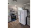 Updated kitchen with granite countertops, gray cabinets, stainless steel sink, and stainless appliances at 4080 Brushymill Ct, Loganville, GA 30052