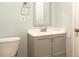 Bathroom featuring a gray vanity cabinet, white countertop, and modern faucet at 679 Winchester Ln, Norcross, GA 30071